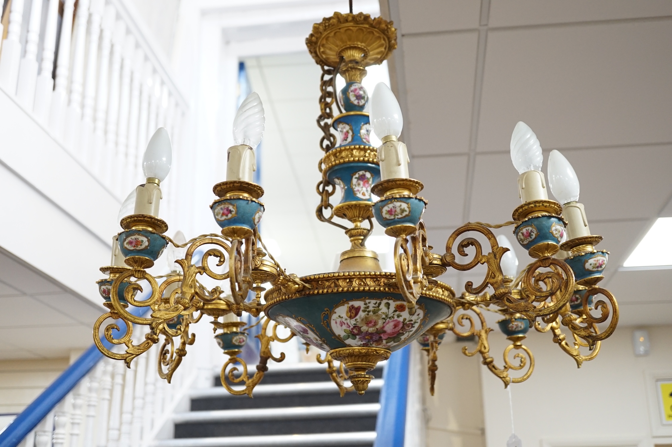 A Sevres style porcelain and gilt metal mounted twelve light chandelier, late 19th / 20th century, 60cm high excluding chain. Condition - fair